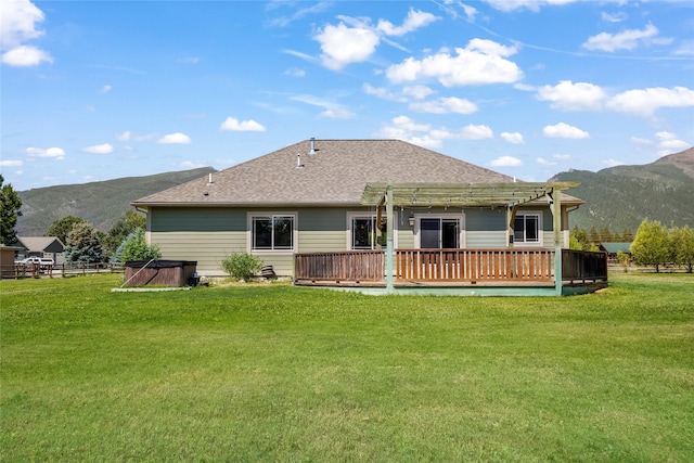 10 Canyon Breeze Ct, Stevensville, MT 59870 - rear view of property featuring a pergola, a deck with mountain view, a yard, and a shingled roof
