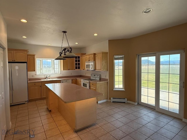 4160 Geneva Ln, Butte, MT 59701 - kitchen with white appliances, a baseboard radiator, light countertops, light brown cabinets, and recessed lighting