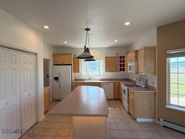 4160 Geneva Ln, Butte, MT 59701 - kitchen featuring white appliances, baseboard heating, light brown cabinets, a center island, and a sink