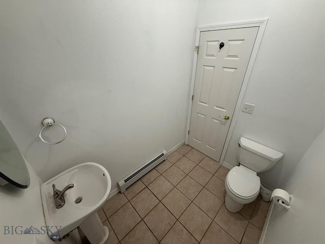 4160 Geneva Ln, Butte, MT 59701 - bathroom featuring a baseboard radiator, tile patterned floors, toilet, and baseboards