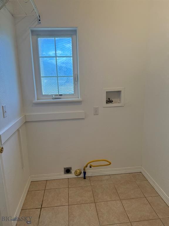 4160 Geneva Ln, Butte, MT 59701 - laundry room featuring washer hookup, baseboards, light tile patterned flooring, and hookup for a gas dryer