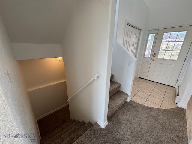 4160 Geneva Ln, Butte, MT 59701 - stairs with carpet, tile patterned floors, and a baseboard radiator