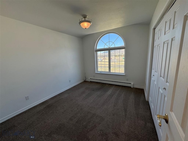 4160 Geneva Ln, Butte, MT 59701 - unfurnished bedroom with baseboard heating, dark colored carpet, and baseboards