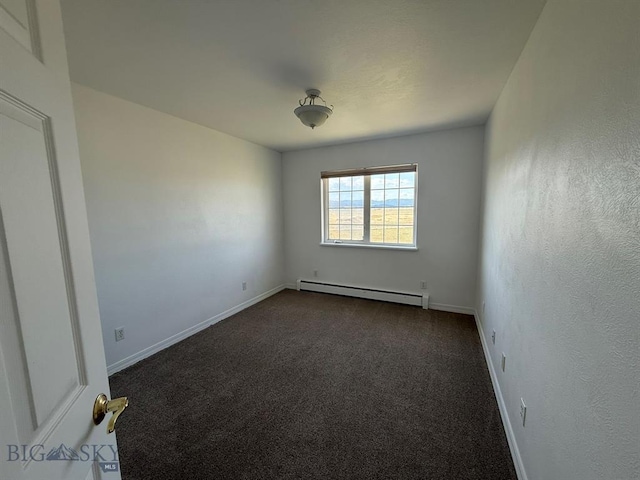 4160 Geneva Ln, Butte, MT 59701 - spare room with baseboard heating, dark carpet, and baseboards