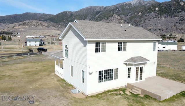4160 Geneva Ln, Butte, MT 59701 - rear view of house with a patio, a mountain view, and roof with shingles