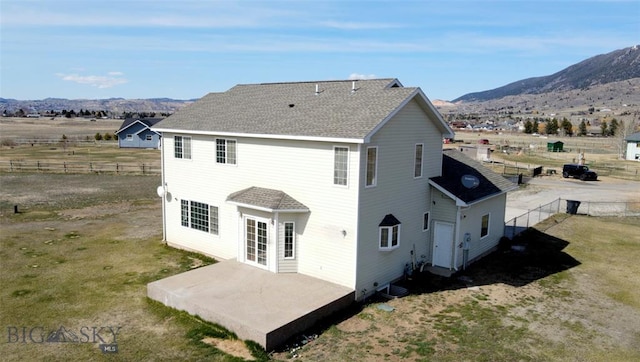 4160 Geneva Ln, Butte, MT 59701 - back of property featuring a patio area, a mountain view, and roof with shingles