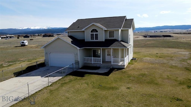 4160 Geneva Ln, Butte, MT 59701 - traditional home featuring a porch, a garage, a mountain view, and driveway