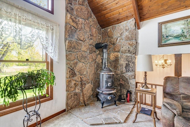 70 Dune Hill Ln, Great Falls, MT 59404 - carpeted living room with wood ceiling, a chandelier, baseboards, and a wood stove