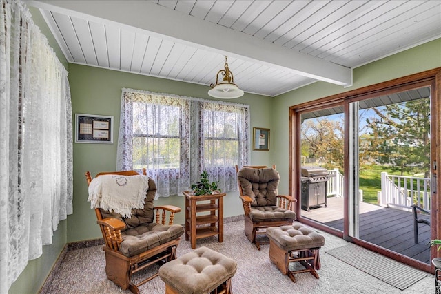 70 Dune Hill Ln, Great Falls, MT 59404 - sitting room featuring carpet floors, baseboards, and wooden ceiling with exposed beams
