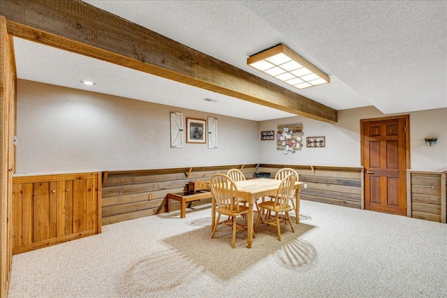 70 Dune Hill Ln, Great Falls, MT 59404 - carpeted dining space featuring a textured ceiling, wainscoting, and wood walls