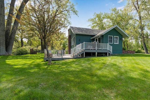 70 Dune Hill Ln, Great Falls, MT 59404 - back of property featuring a wooden deck, a lawn, and a shingled roof