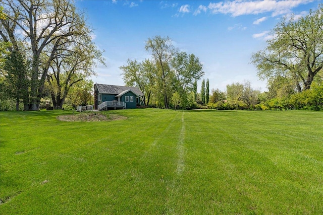 70 Dune Hill Ln, Great Falls, MT 59404 - view of green lawn featuring a deck