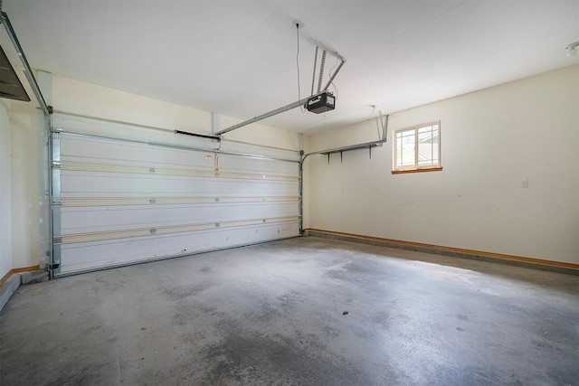 1605 Lund Ln, Polson, MT 59860 - garage featuring baseboards and a garage door opener