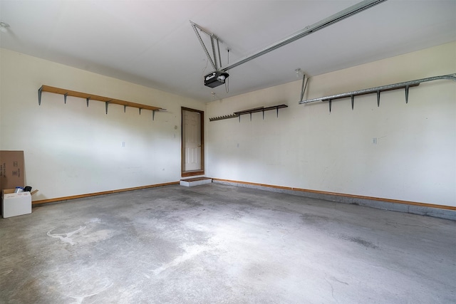 1605 Lund Ln, Polson, MT 59860 - garage featuring baseboards and a garage door opener