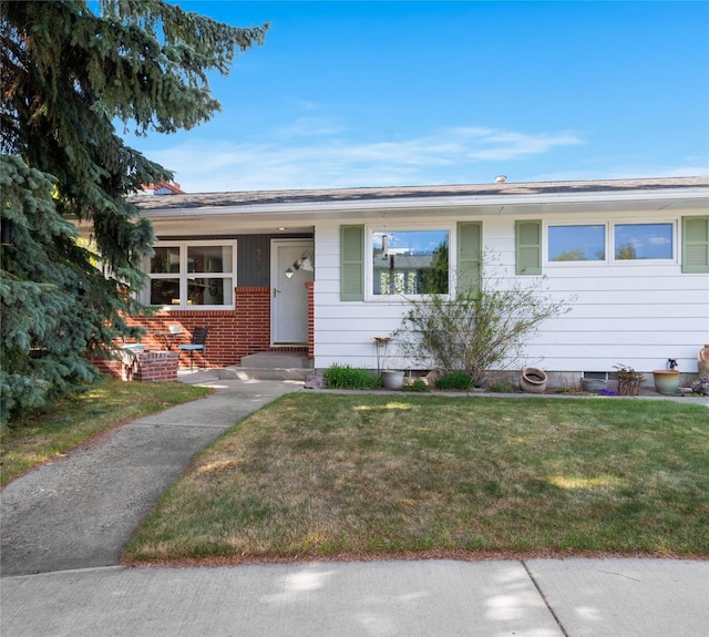 2030 Highland St, Helena, MT 59601 - ranch-style home featuring a front yard and brick siding