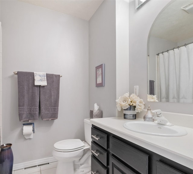 2030 Highland St, Helena, MT 59601 - full bath with toilet, tile patterned flooring, vanity, baseboards, and a shower with shower curtain