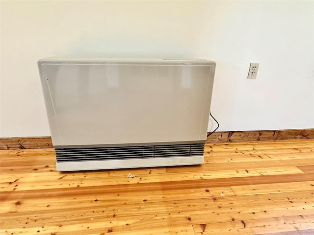 310 W Armitage St, Ennis, MT 59729 - detailed view of heating unit and wood finished floors