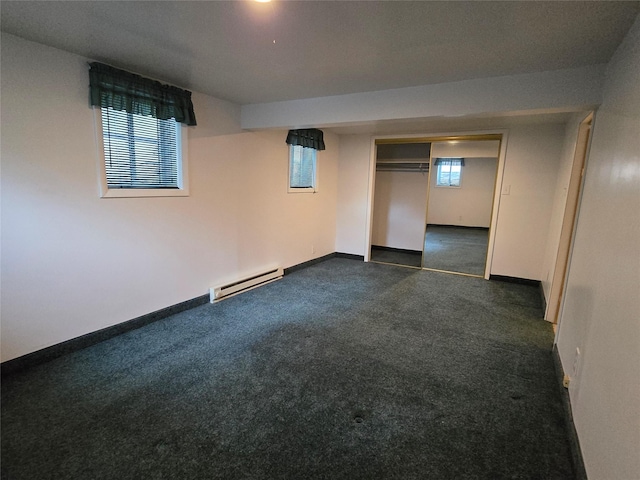 3421 4th Ave N, Great Falls, MT 59401 - basement featuring baseboard heating, baseboards, and dark carpet