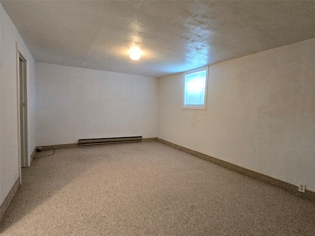 3421 4th Ave N, Great Falls, MT 59401 - empty room with a baseboard heating unit, light carpet, baseboards, and a textured ceiling