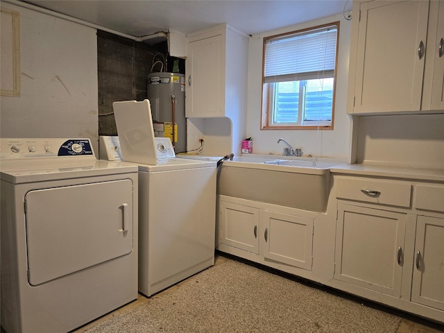 3421 4th Ave N, Great Falls, MT 59401 - laundry area with water heater, washer and clothes dryer, and cabinet space