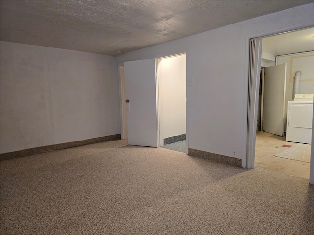 3421 4th Ave N, Great Falls, MT 59401 - spare room with washer / dryer, a textured ceiling, and baseboards