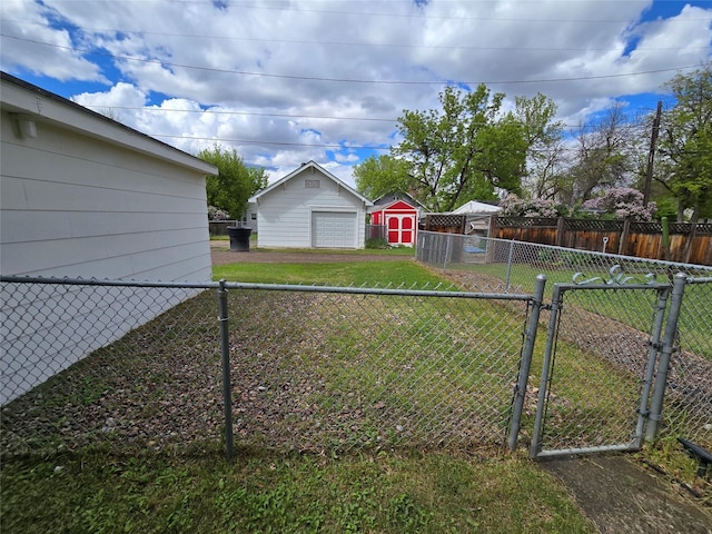 3421 4th Ave N, Great Falls, MT 59401 - view of yard with a gate, driveway, and a garage