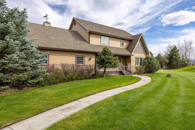 150 Painted Mdws, Butte, MT 59701 - view of front of home featuring a front lawn, a chimney, and roof with shingles