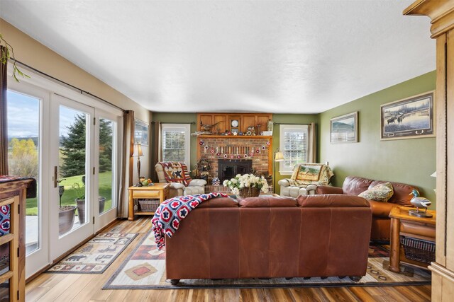 150 Painted Mdws, Butte, MT 59701 - living area with healthy amount of natural light, wood finished floors, and a fireplace