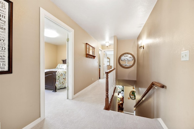 150 Painted Mdws, Butte, MT 59701 - hallway with an upstairs landing, carpet flooring, and baseboards
