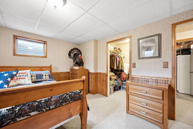 150 Painted Mdws, Butte, MT 59701 - bedroom with a spacious closet, a closet, wainscoting, a paneled ceiling, and light carpet