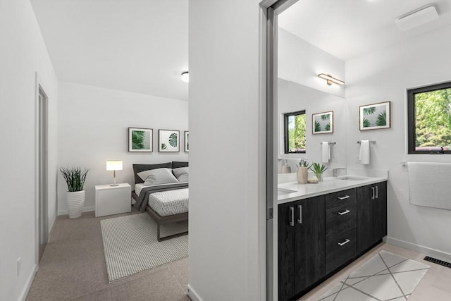 713 W 2nd St W, Whitefish, MT 59937 - ensuite bathroom with healthy amount of natural light, double vanity, and baseboards