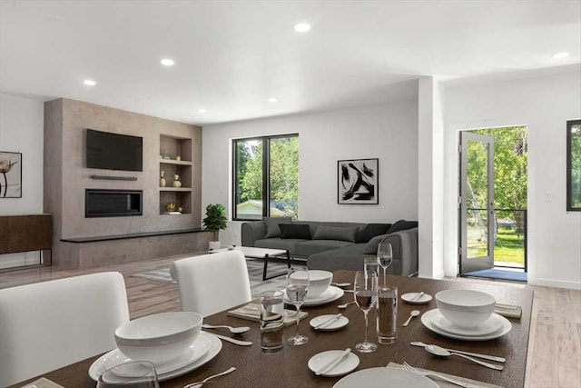 713 W 2nd St W, Whitefish, MT 59937 - dining space featuring built in shelves, recessed lighting, and wood finished floors
