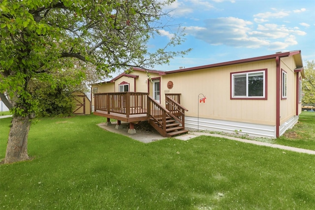 3805 7th St NE Unit 107, Great Falls, MT 59404 - view of front of property with a deck, a front lawn, and a gate