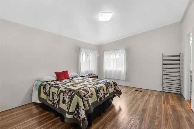 3805 7th St NE Unit 107, Great Falls, MT 59404 - bedroom with wood finished floors and lofted ceiling