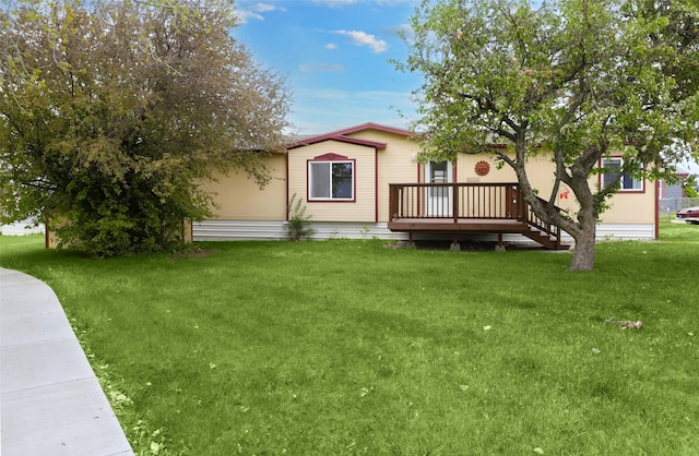3805 7th St NE Unit 107, Great Falls, MT 59404 - rear view of house featuring a wooden deck and a lawn