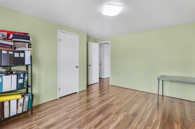 3805 7th St NE Unit 107, Great Falls, MT 59404 - unfurnished bedroom with wood finished floors