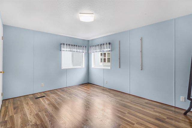 3805 7th St NE Unit 107, Great Falls, MT 59404 - unfurnished bedroom with wood finished floors