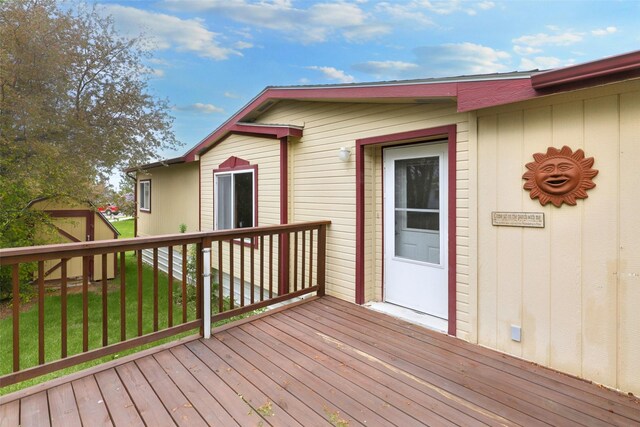 3805 7th St NE Unit 107, Great Falls, MT 59404 - wooden terrace featuring a lawn