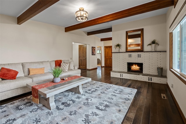 38941 Baypoint Ln, Polson, MT 59860 - living room with beamed ceiling, baseboards, a brick fireplace, and wood finished floors