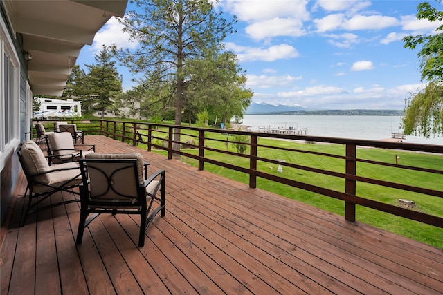 38941 Baypoint Ln, Polson, MT 59860 - deck featuring a water view and a lawn