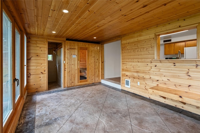 38941 Baypoint Ln, Polson, MT 59860 - tiled spare room featuring recessed lighting, wood walls, and wood ceiling