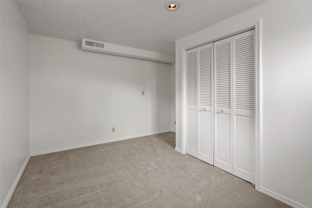 38941 Baypoint Ln, Polson, MT 59860 - unfurnished bedroom with carpet, a closet, and baseboards