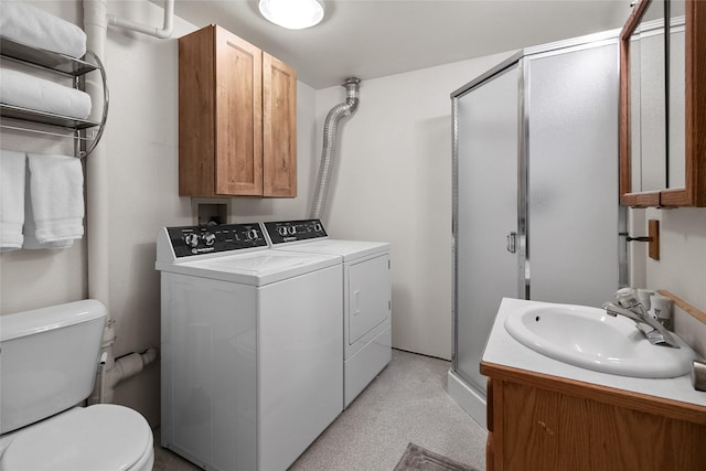 38941 Baypoint Ln, Polson, MT 59860 - full bath featuring washing machine and clothes dryer, a stall shower, toilet, and vanity
