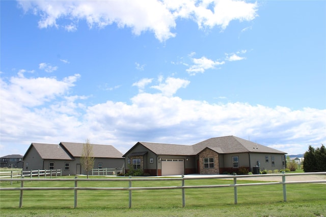 2567 Reardon Rd, Helena, MT 59602 - ranch-style house with a garage, stone siding, and driveway