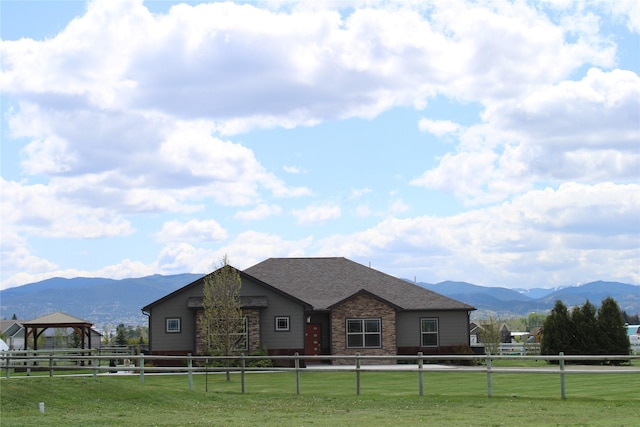 2567 Reardon Rd, Helena, MT 59602 - view of front of home featuring a mountain view, a gazebo, stone siding, and a shingled roof