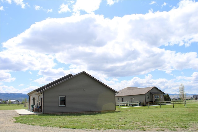 2567 Reardon Rd, Helena, MT 59602 - view of home's exterior with a patio and a mountain view