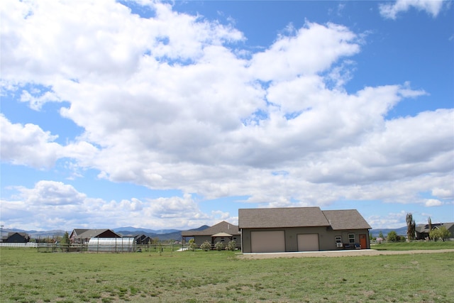 2567 Reardon Rd, Helena, MT 59602 - view of yard with an attached garage and a view of countryside