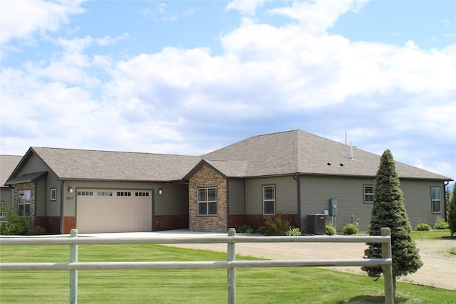 2567 Reardon Rd, Helena, MT 59602 - view of front of home with driveway, a garage, cooling unit, and a shingled roof