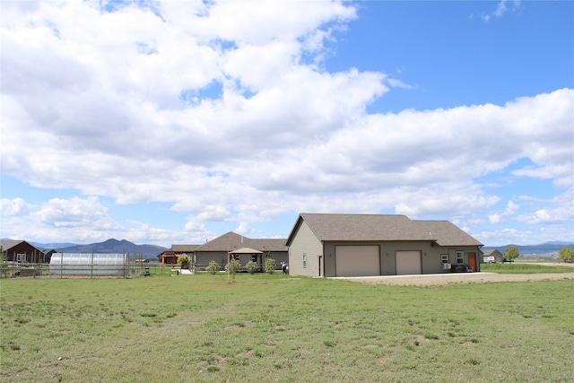 2567 Reardon Rd, Helena, MT 59602 - view of yard with a garage and a mountain view