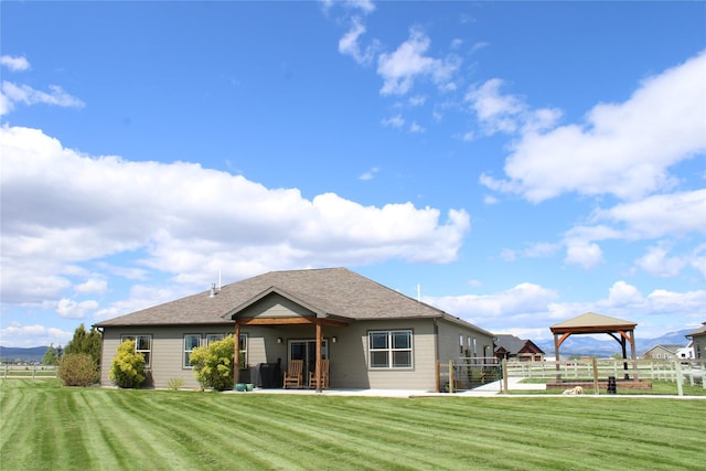 2567 Reardon Rd, Helena, MT 59602 - back of house with a gazebo, a patio, and a shingled roof